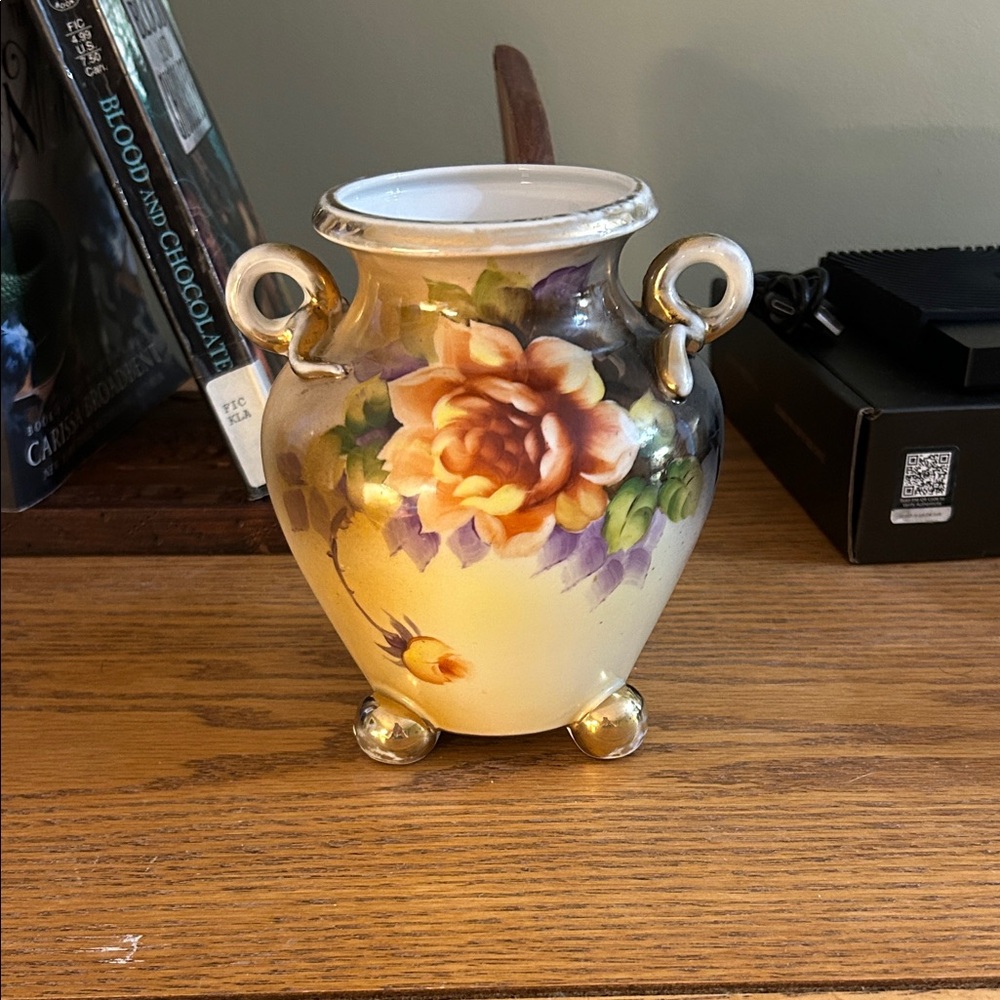Hand-painted Noritake porcelain set with floral motif and gold accents